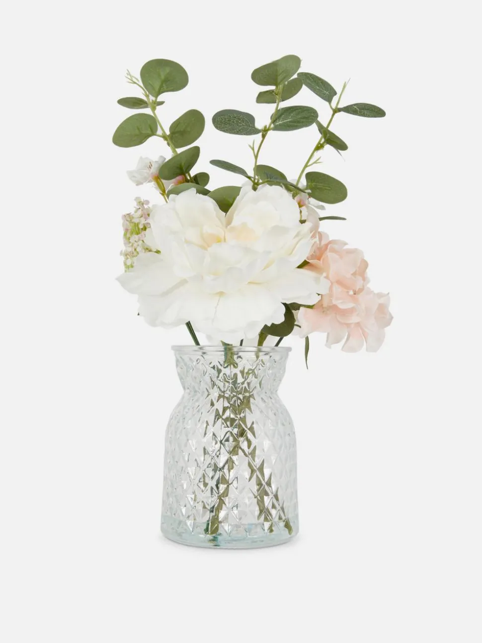 Aranżacja ze sztucznych kwiatów w szklanym wazonie