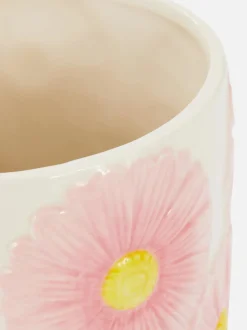 Ceramiczna doniczka z motywem kwiatowym