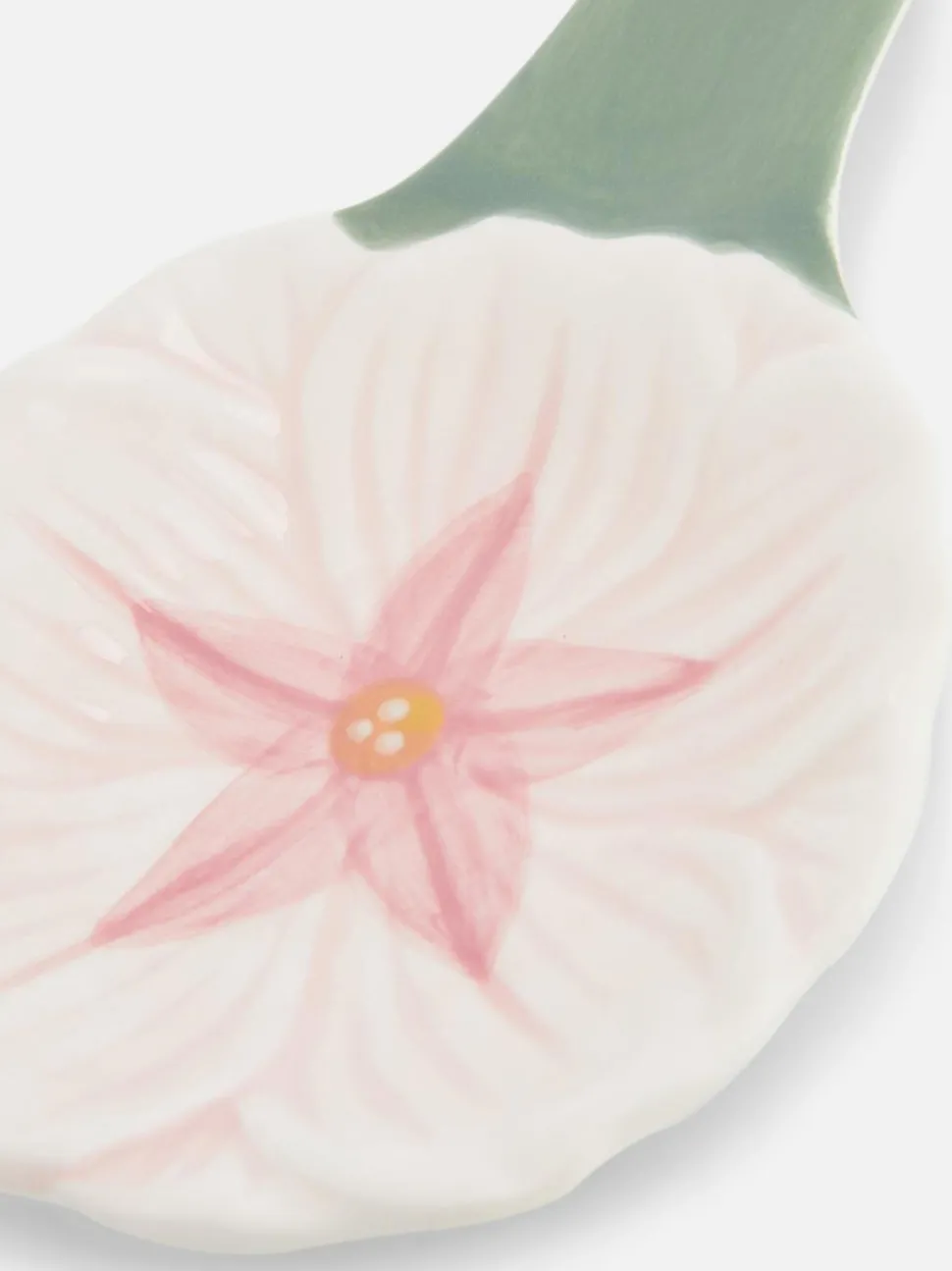 Ceramiczna podstawka pod łyżkę z motywem kwiatka