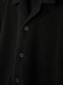 Dżersejowa koszula z zapięciem na guziki