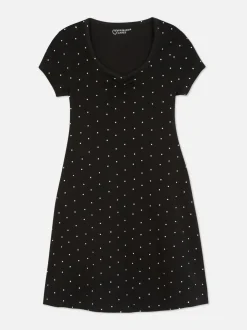 Dżersejowa sukienka w kropki z dekoltem w serek