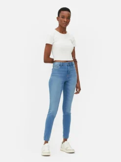 Jeansy ze średnim stanem o kroju skinny | standard