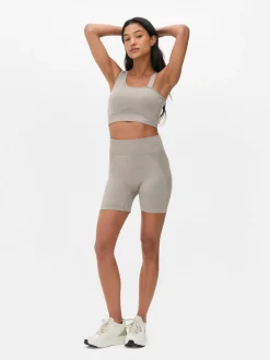 Krótki asymetryczny top Kappa x Primark