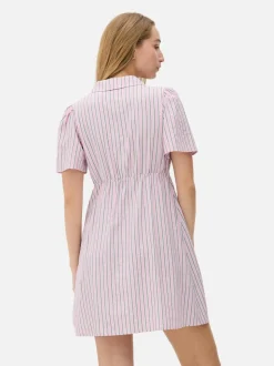 Minisukienka popołudniowa w paski z guzikami