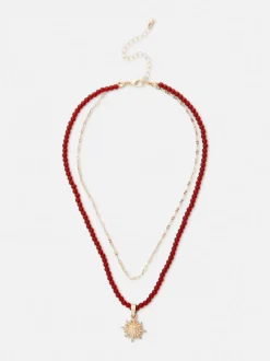 Naszyjnik z koralików z wisiorkiem z motywem słońca