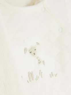 Pikowany komplet z topem i spodniami z aplikacją