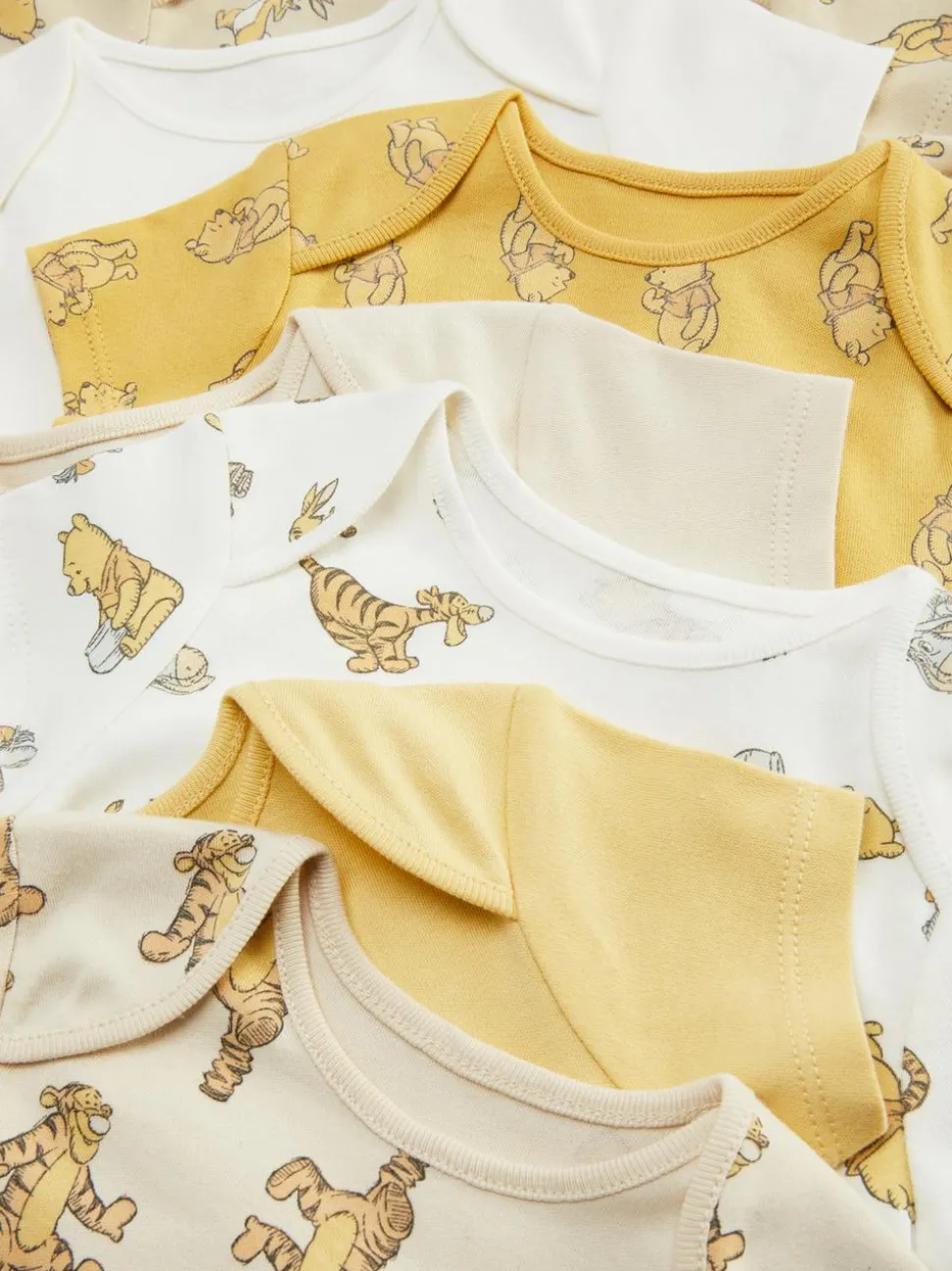 Śpioszki z motywem Kubusia Puchatka Disneya, 7 szt.