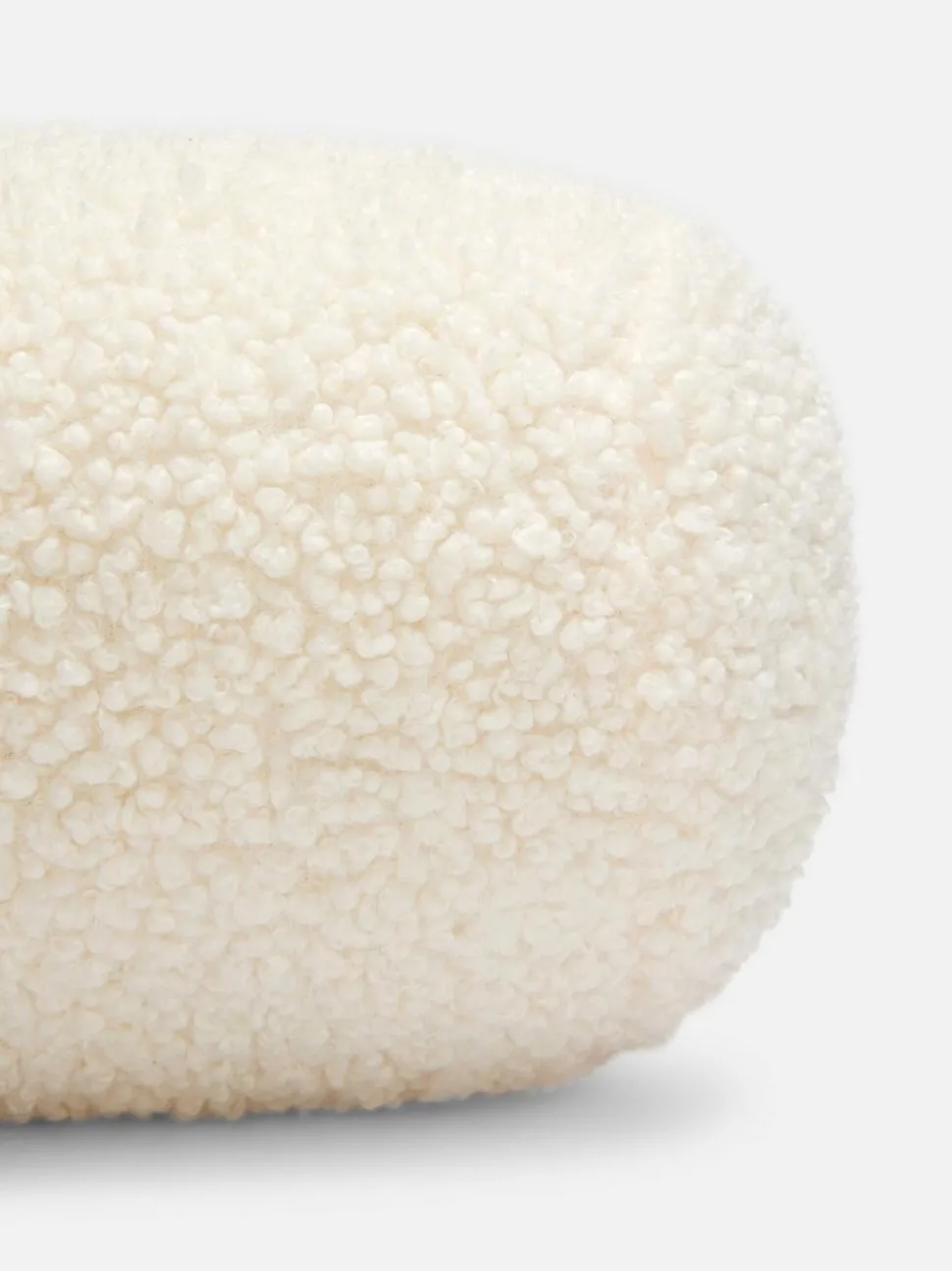 Poduszka w kształcie wałka z tkaniny bouclé