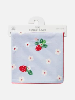 Poduszka ze wzorem w kwiaty i truskawki