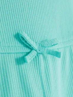 Prążkowany kombinezon z falbanką