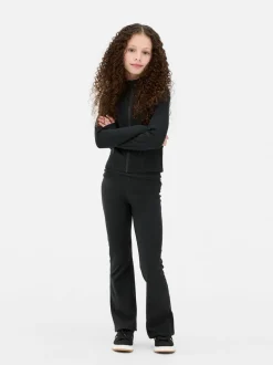 Rozciągliwe legginsy sportowe z rozszerzaną nogawką