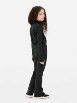 Rozciągliwe legginsy sportowe z rozszerzaną nogawką