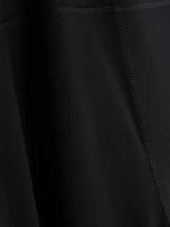 Rozciągliwe legginsy sportowe z rozszerzaną nogawką