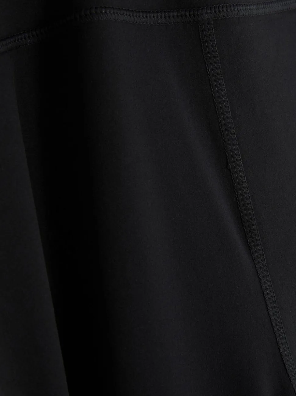 Rozciągliwe legginsy sportowe z rozszerzaną nogawką