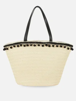 Słomkowa torba typu bucket z pomponikami