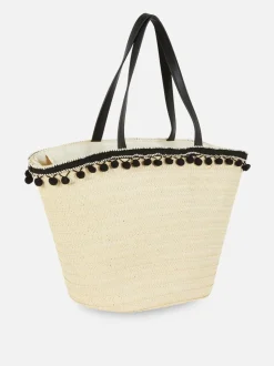 Słomkowa torba typu bucket z pomponikami