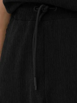 Spodnie o marszczonej fakturze ze sznurkiem Kem