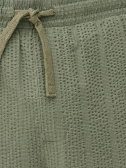 Spodnie w paski z tkaniny seersucker