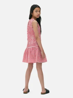 Sukienka w kratkę z marszczeniami i niskim stanem