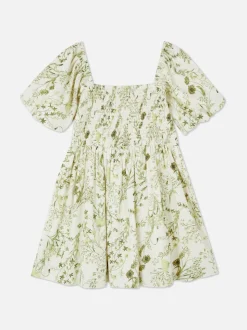 Sukienka w kwiaty z bufiastymi rękawami