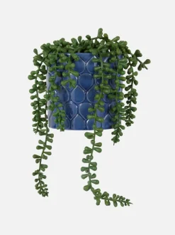 Sztuczna roślina pnąca w ceramicznej doniczce