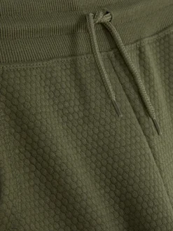 Teksturowane spodnie dresowe ściągane sznurkiem