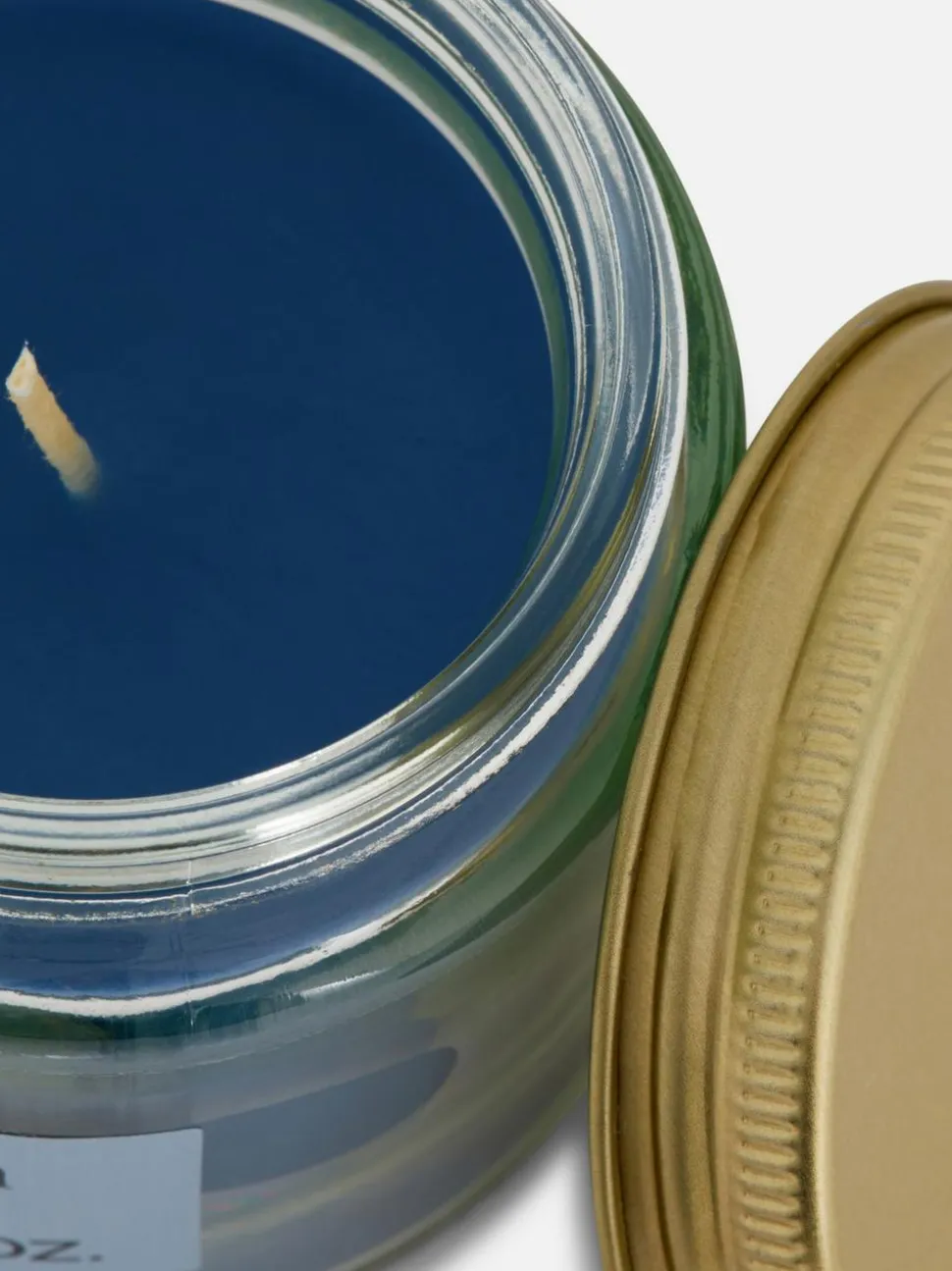 Świeca zapachowa w małym słoiczku z pokrywką