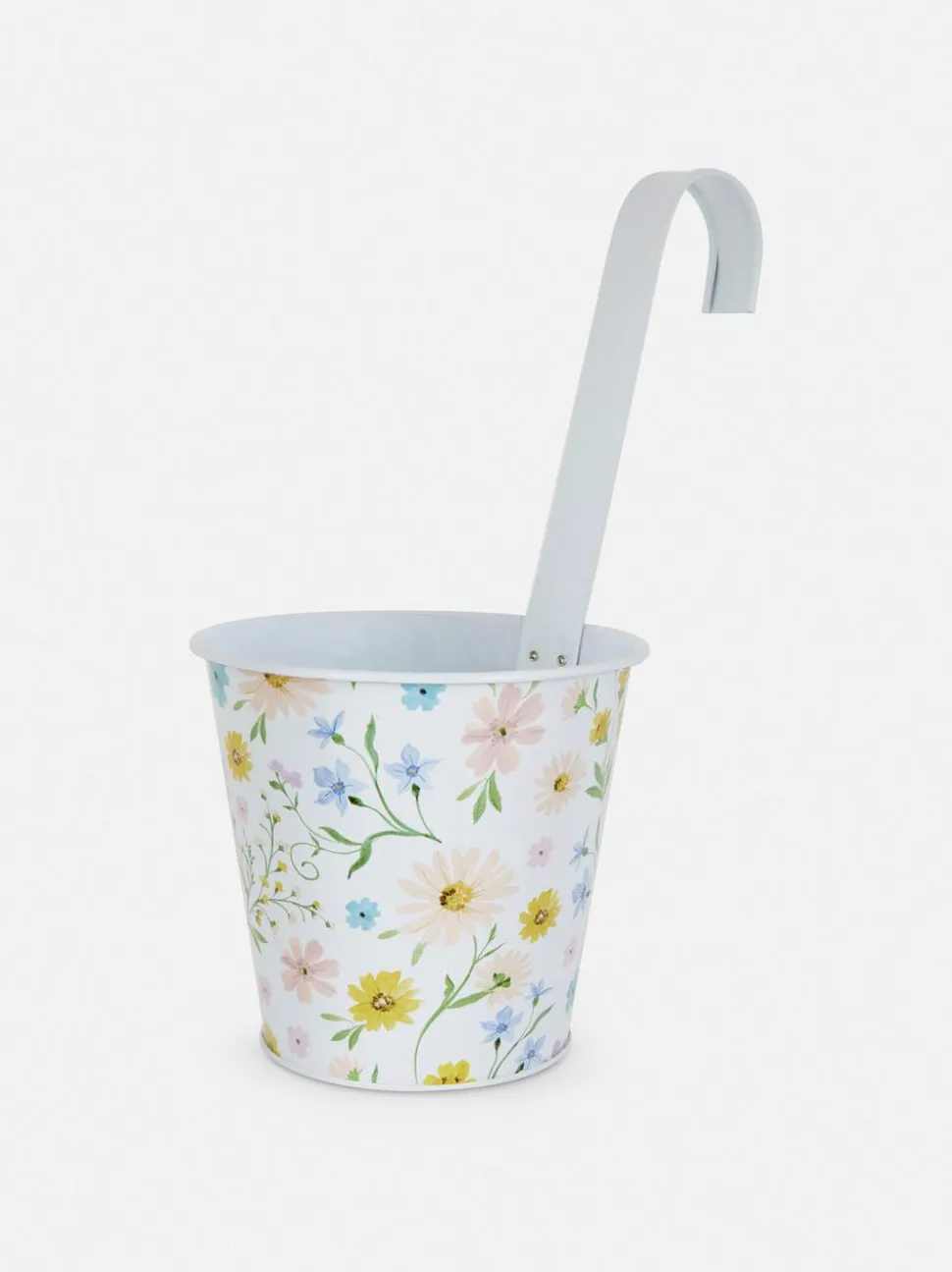 Wisząca metalowa doniczka ze wzorem w kwiaty