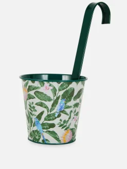 Wisząca metalowa doniczka ze wzorem w kwiaty