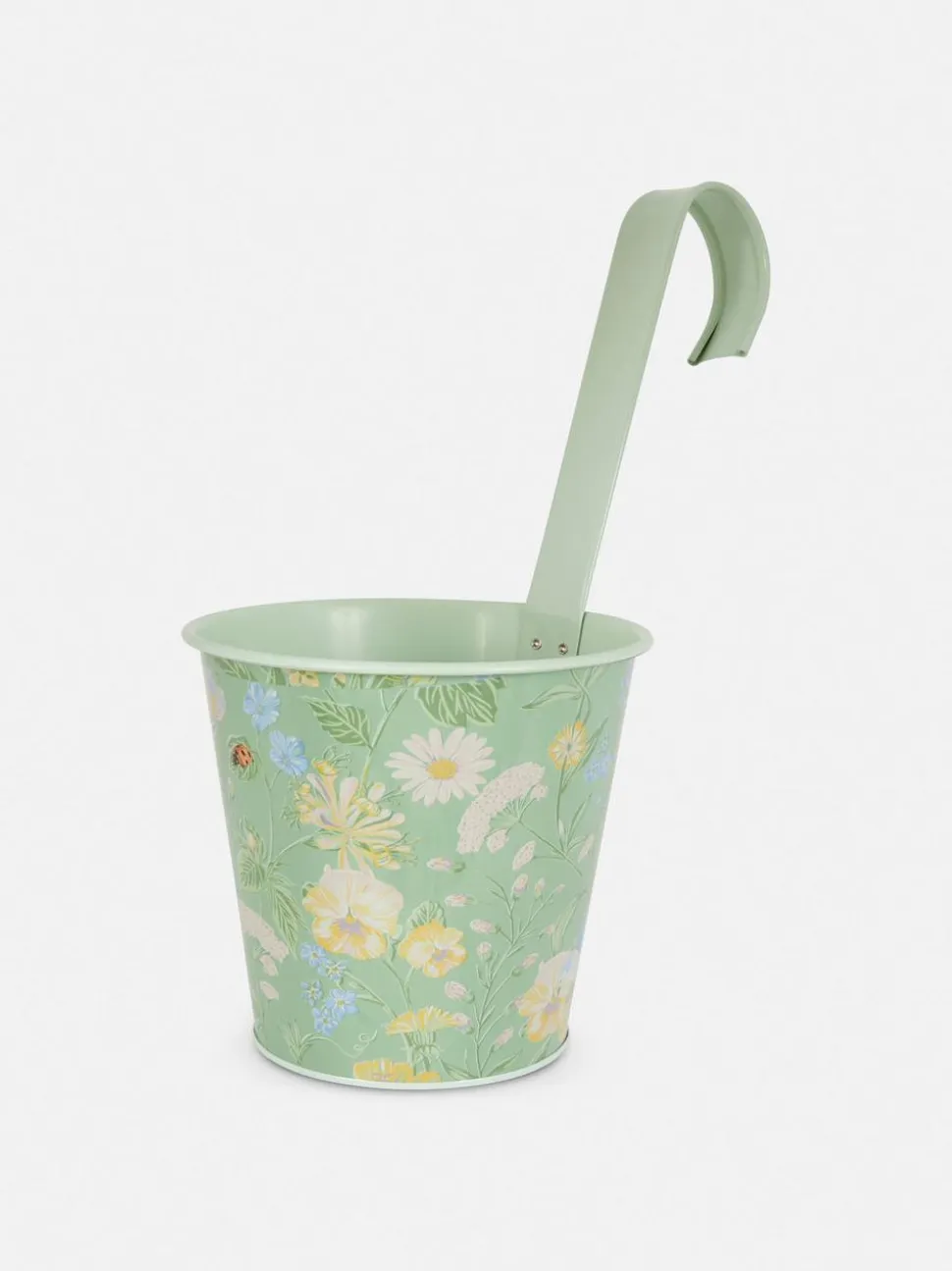 Wisząca metalowa doniczka ze wzorem w kwiaty