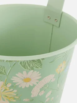 Wisząca metalowa doniczka ze wzorem w kwiaty