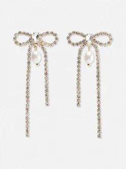 Wiszące kolczyki w kształcie kokardki z diamencikami