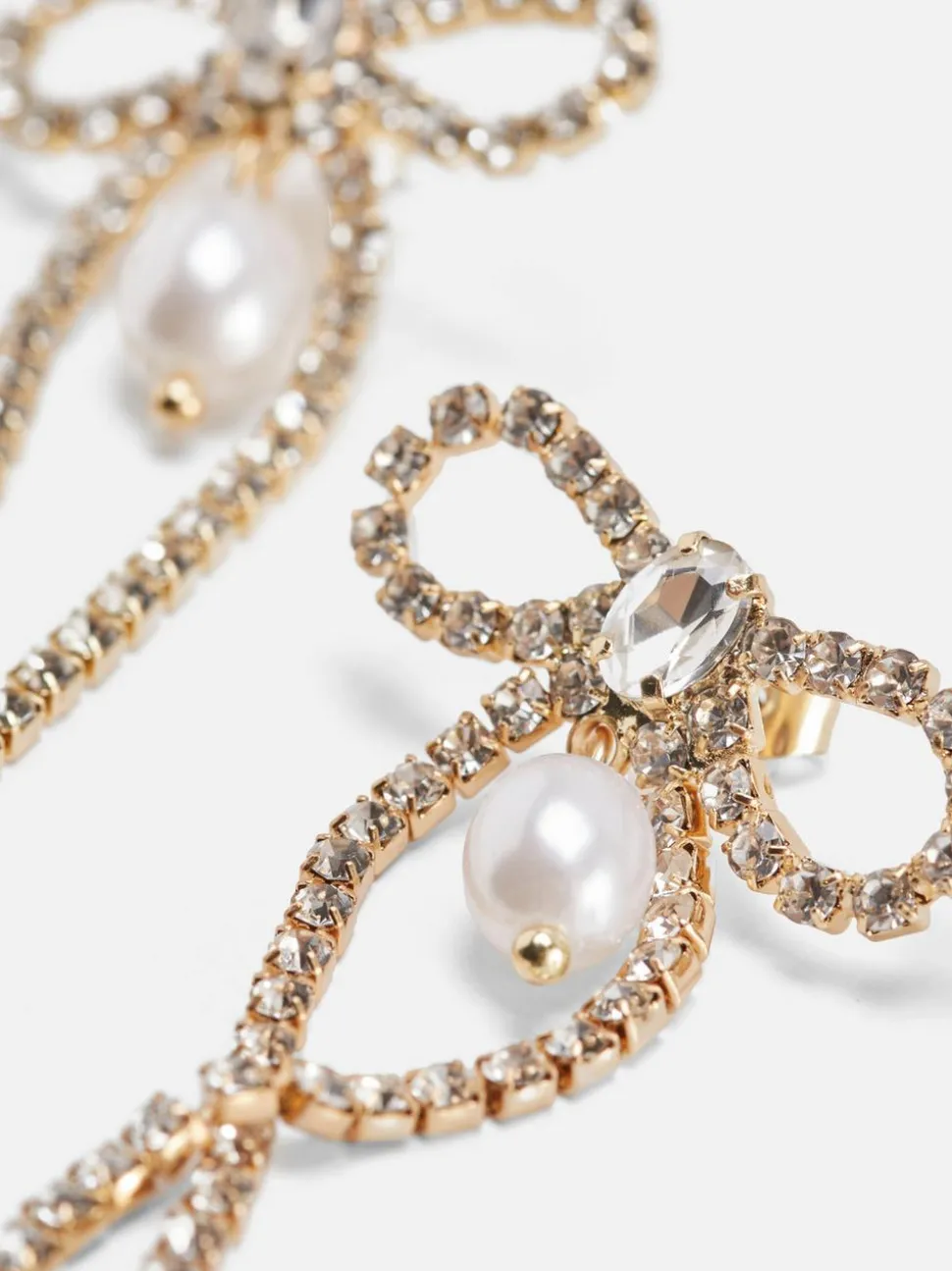 Wiszące kolczyki w kształcie kokardki z diamencikami