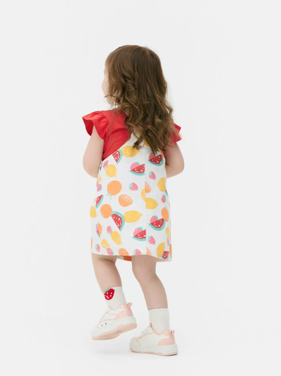 Wzorzysty komplet z sukienką ogrodniczką i topem