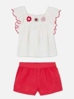 Zestaw z szydełkową bluzką i szortami
