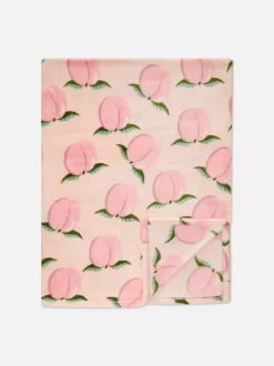 Bardzo miękka narzuta z nadrukiem w brzoskwinie