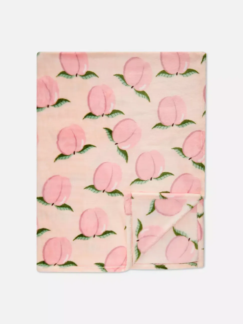 Bardzo miękka narzuta z nadrukiem w brzoskwinie