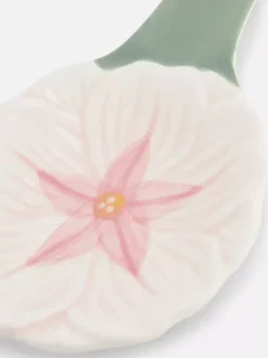 Ceramiczna podstawka pod łyżkę z motywem kwiatka