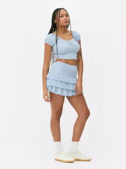 Krótki top z nadrukiem i marszczeniami od zestawu