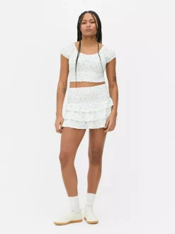 Krótki top z nadrukiem i marszczeniami od zestawu