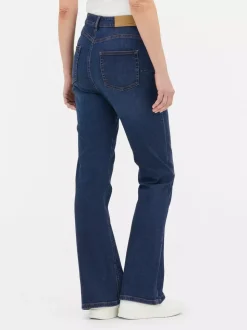 Modelujące jeansy o kroju slim z rozszerzaną nogawką