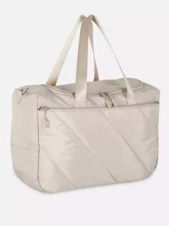 Pikowana torba kabinowa mieszcząca się pod fotelem