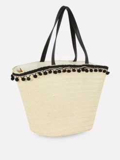 Słomkowa torba typu bucket z pomponikami