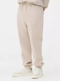 Spodnie dresowe ze ściągaczami i zaszewkami Kem