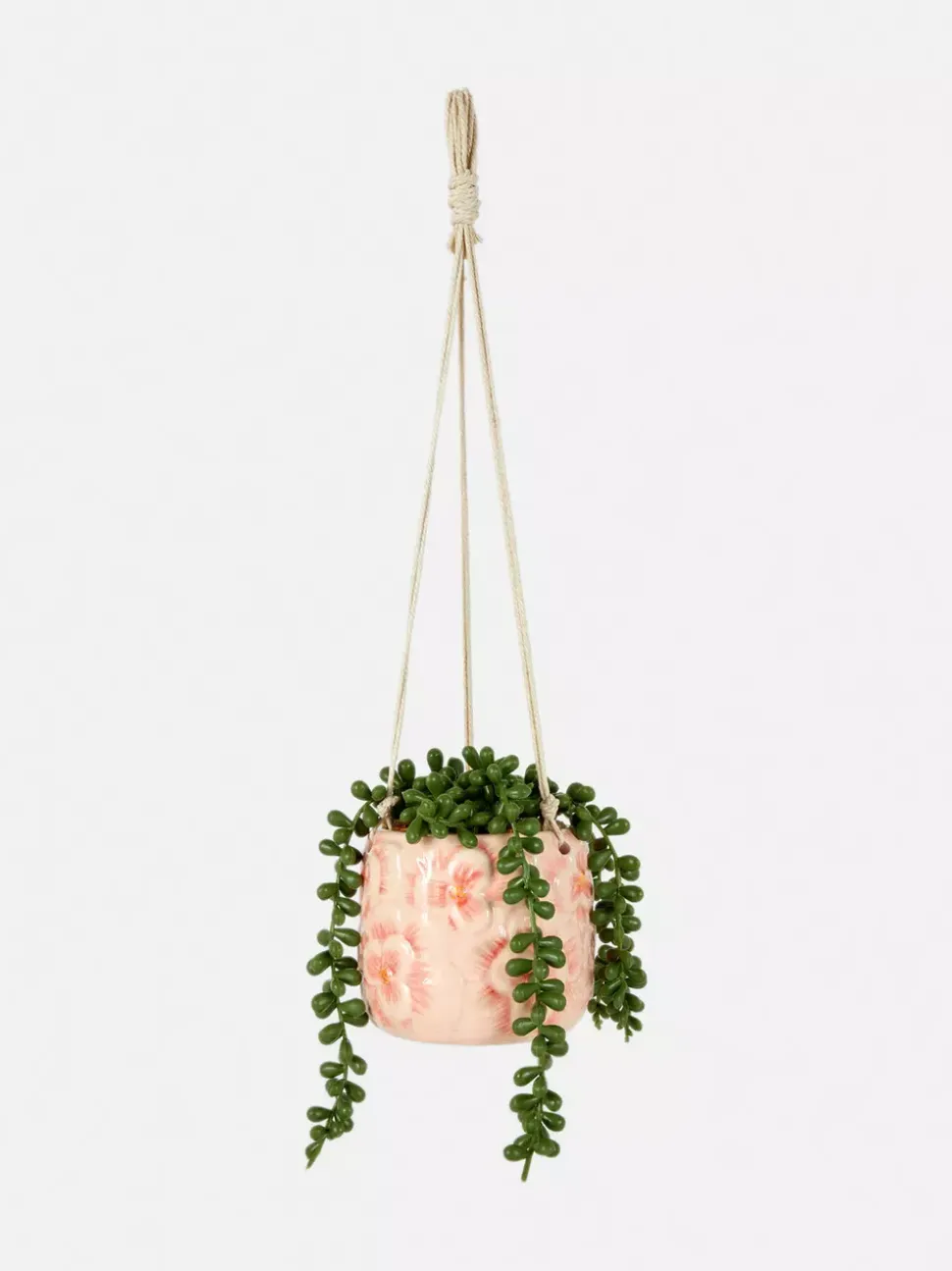 Sztuczna roślina pnąca w wiszącej doniczce