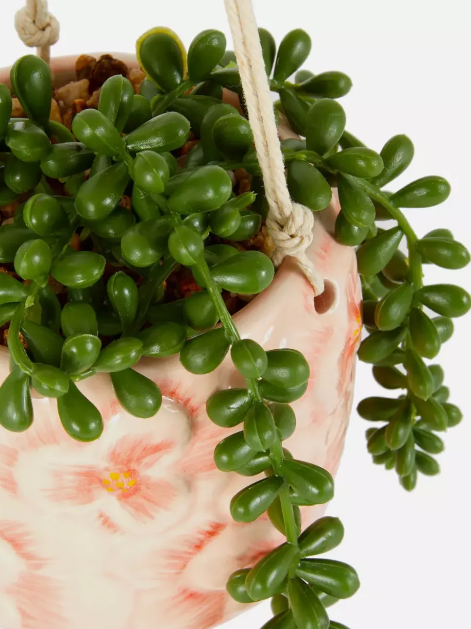 Sztuczna roślina pnąca w wiszącej doniczce