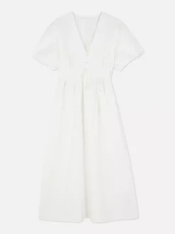 Teksturowana sukienka midi na guziki