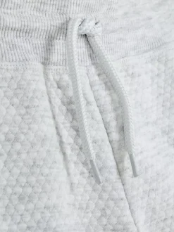 Teksturowane spodnie dresowe z geometrycznym wzorem