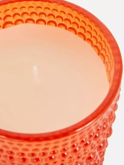 Świeca w szkle o bąbelkowej powierzchni