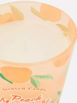 Świeca zapachowa w pojemniku przypominającym kubek